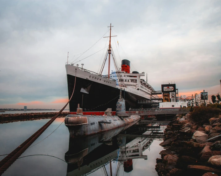 a large boat in the dock in front of a building