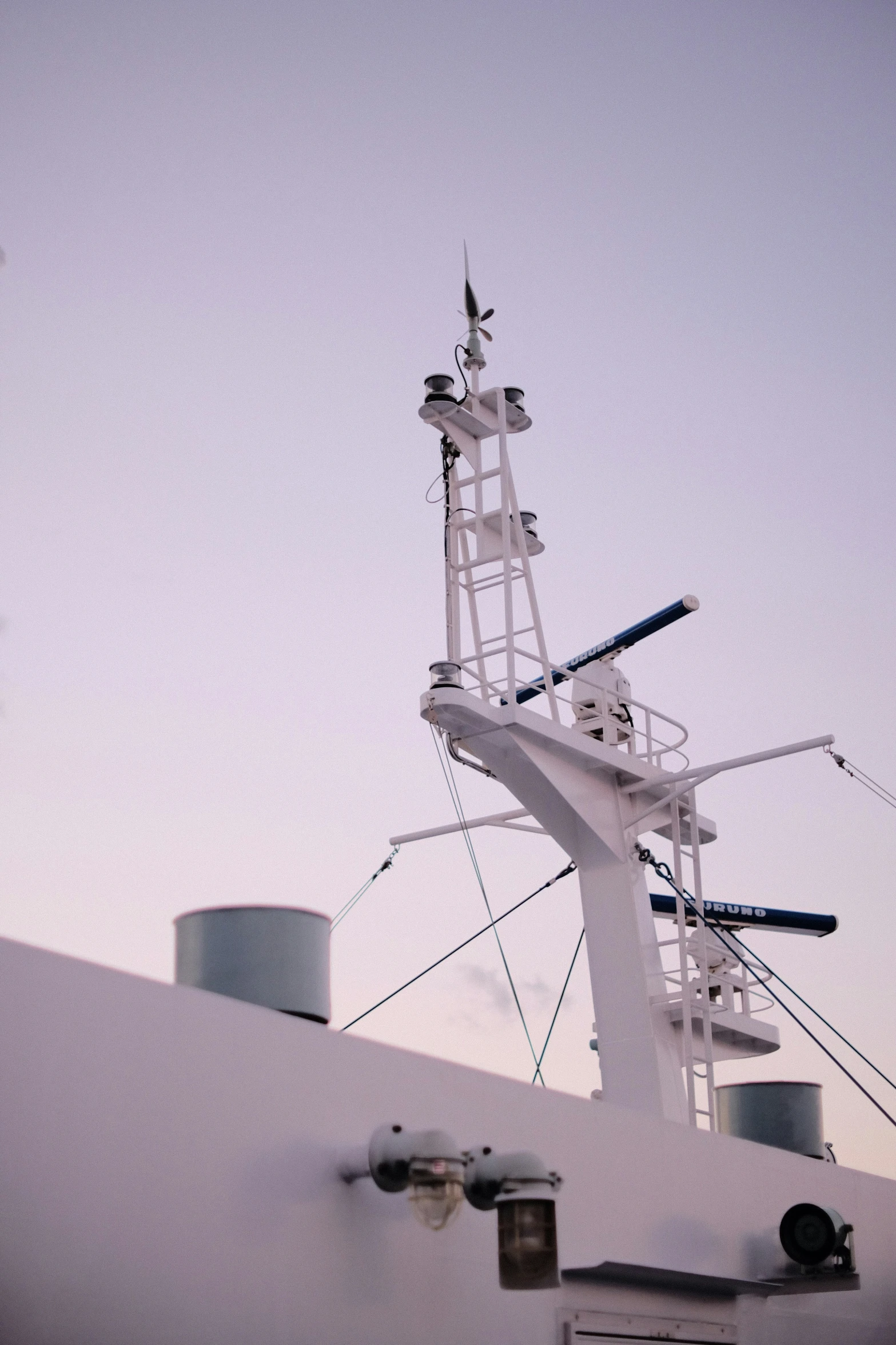 a white ship with a antenna on top