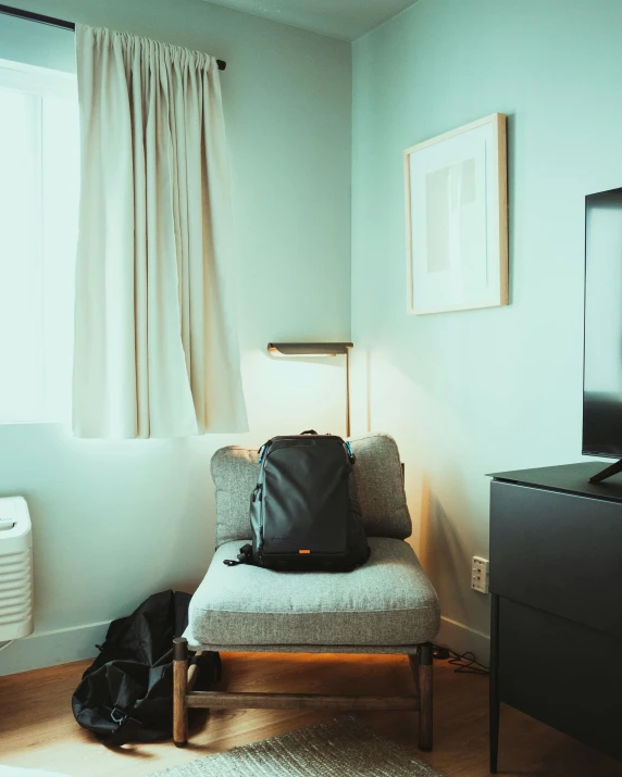 the light is shining on a living room with two pictures