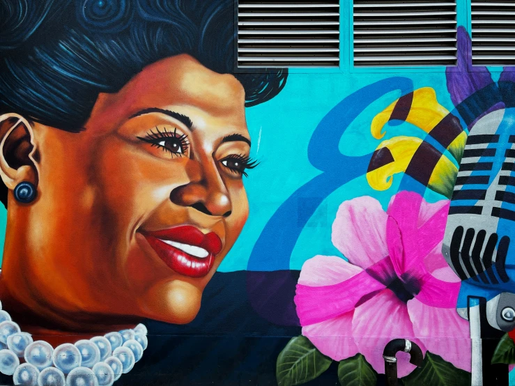 a woman sitting at a microphone painted on the wall