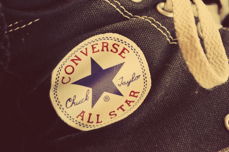 a converse all star label is visible on a pair of jeans