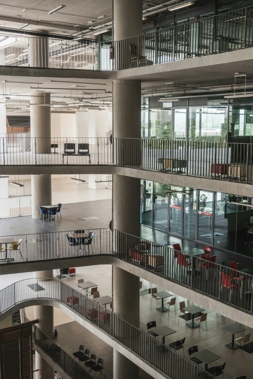 a large modern building has many floors and stairs