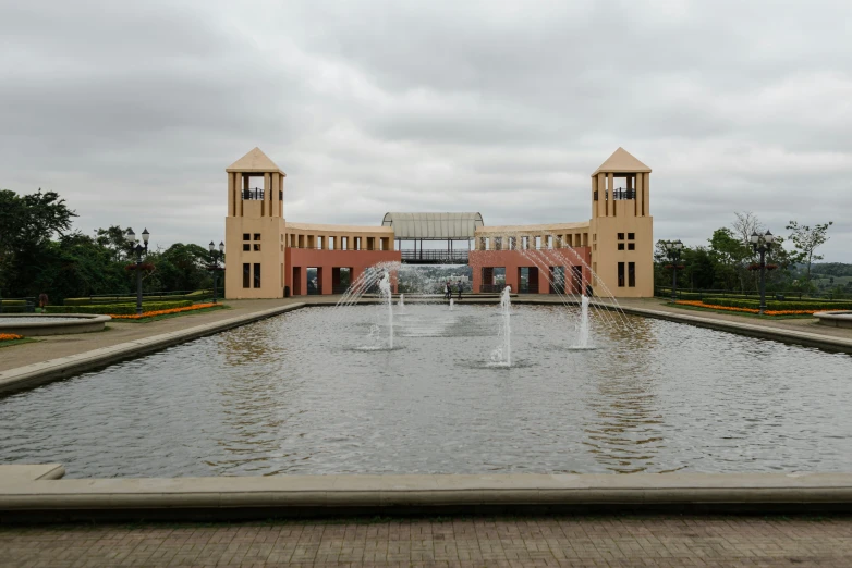 the water and fountain feature a two - story building