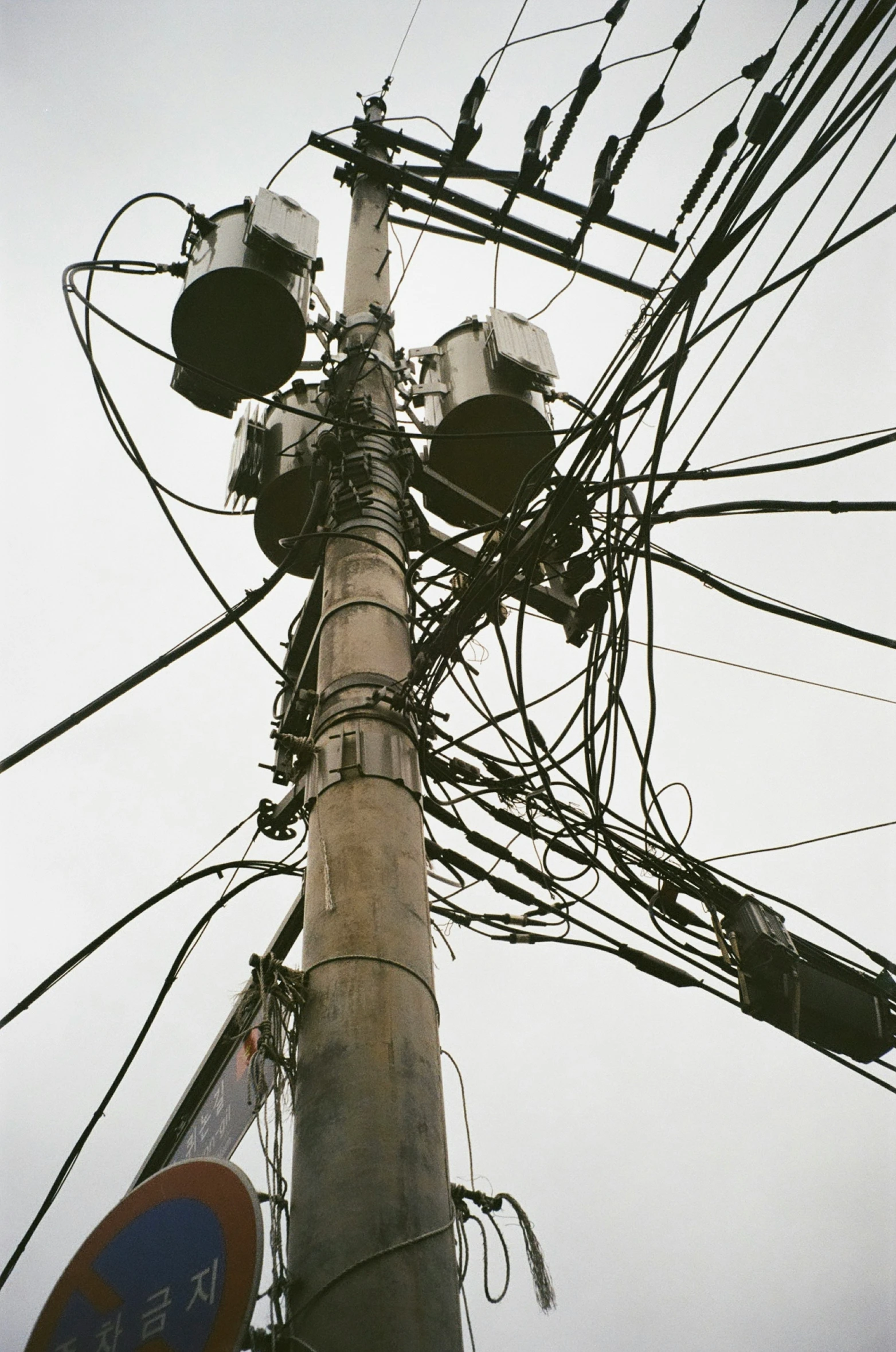 a large pole that has several wires attached to it