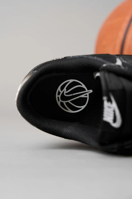 an inside view of a pair of shoes on top of a basketball