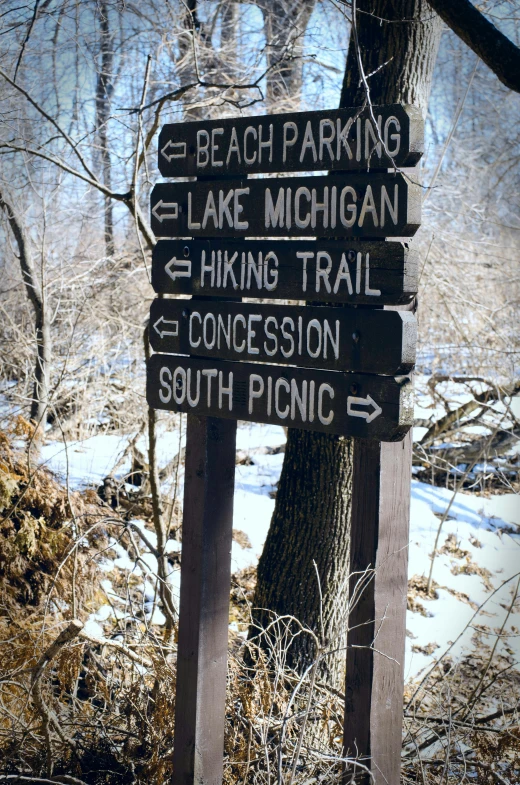 a sign with a bunch of different signs attached to it