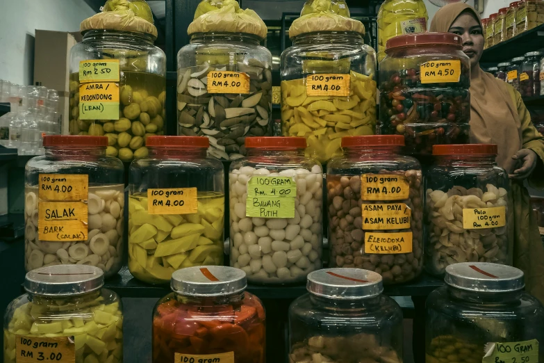 jars filled with assorted beans and other items at a store