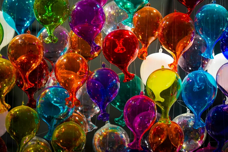 a group of balloons of different colors and sizes