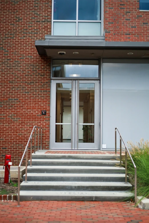 the front doors of an office building with two closed doorways