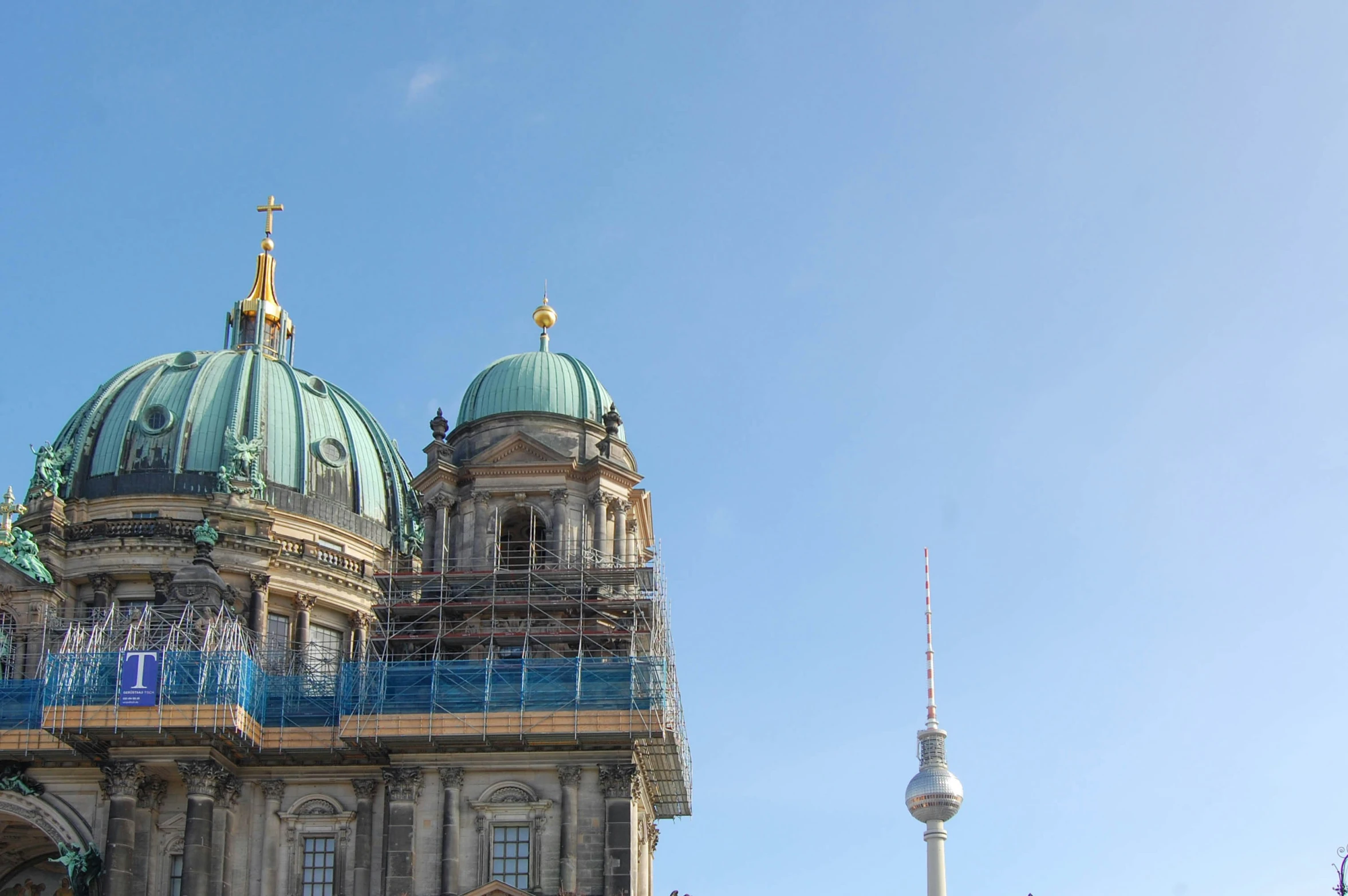 a very big building with some scaffolding around it