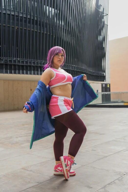 woman with purple hair posing on a skateboard