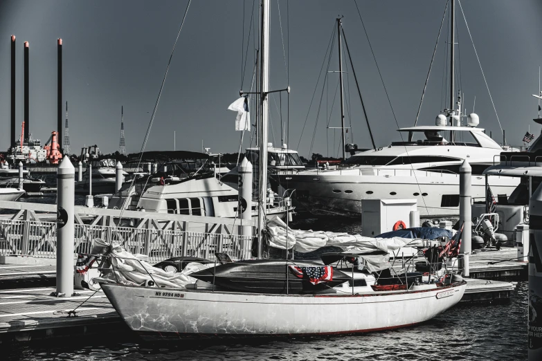 black and white image of a harbor filled with boats