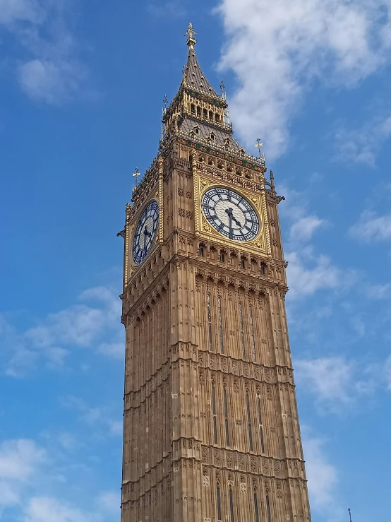 big ben in london with the flag flying high