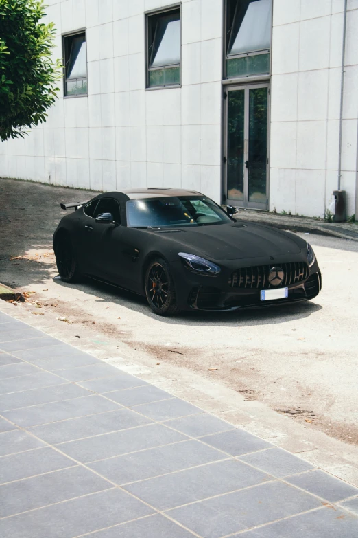 a black sports car parked on the side of the road