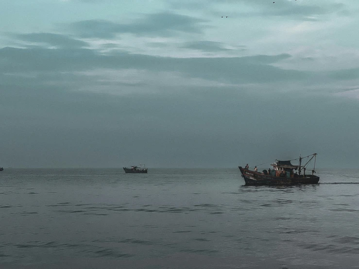 a group of fishing vessels in the ocean
