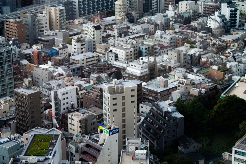 a cityscape of buildings and green roof area