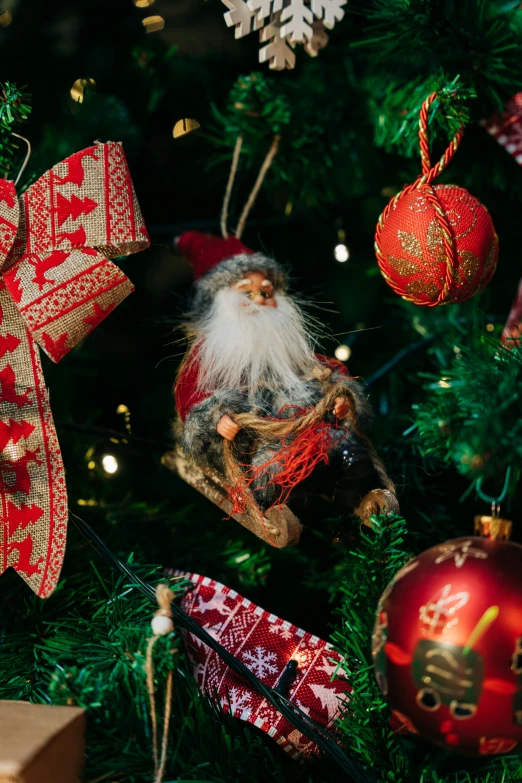 several ornaments are hanging on a christmas tree