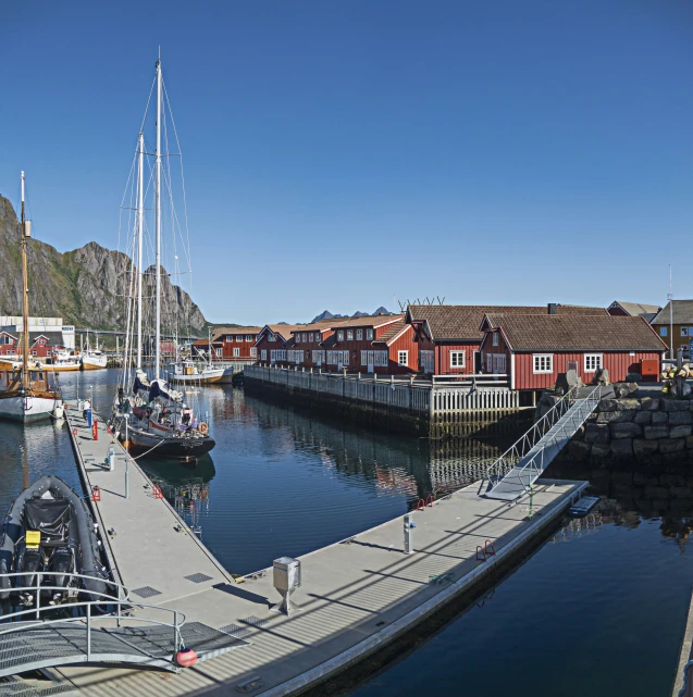 a body of water with boats on it next to buildings and docks