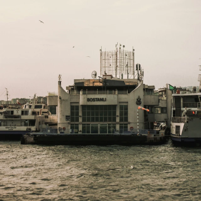 a ferry sitting in a large body of water next to a building