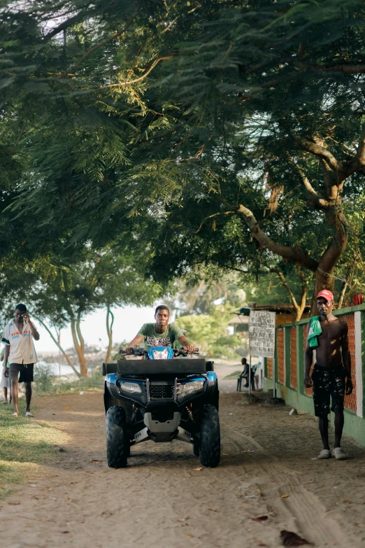 there is a man that is driving a atv