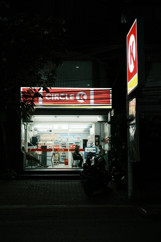 a person sitting in the dark at night