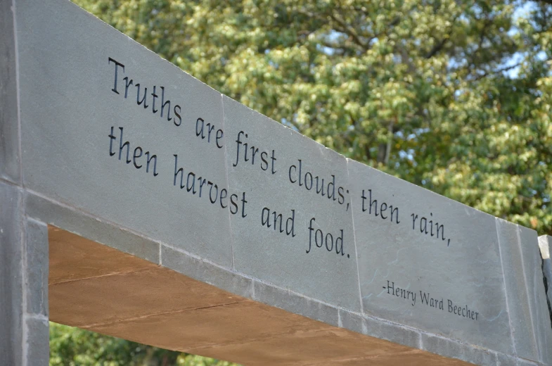 this is a cement wall with a poem on it