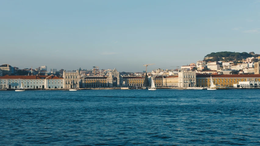 the city sits on top of a hill on the water