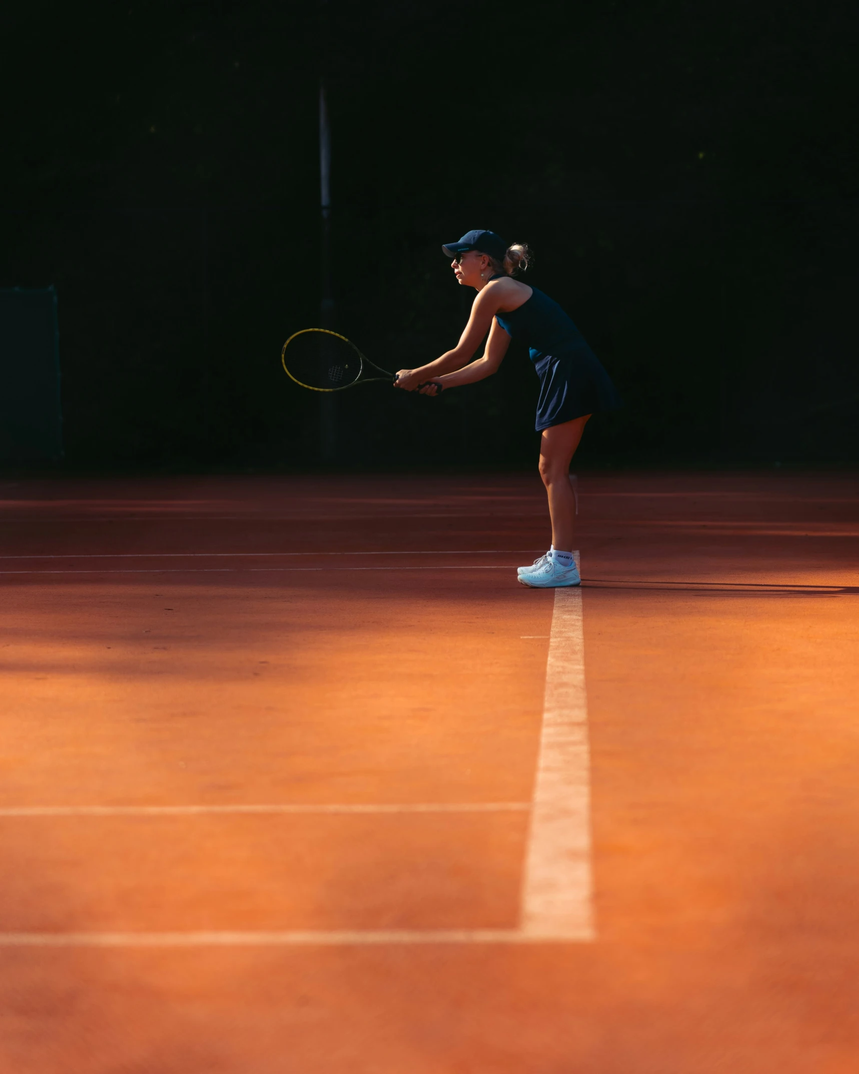 there is a tennis player holding a racket on the court