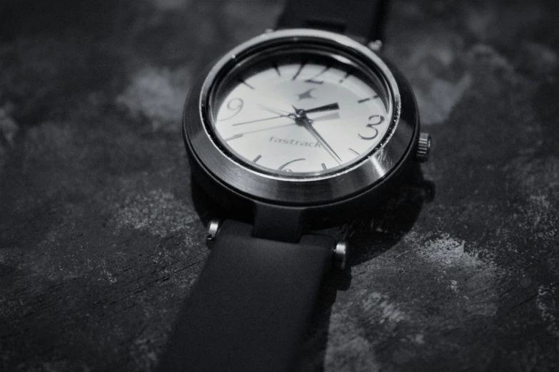 a black and white po of a wrist watch