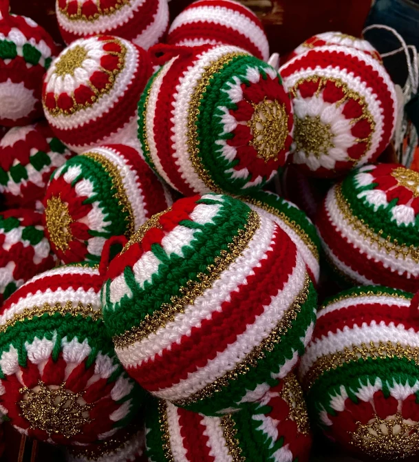 a large pile of christmas balls in different colors