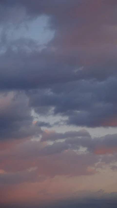 there is a airplane flying through the clouds