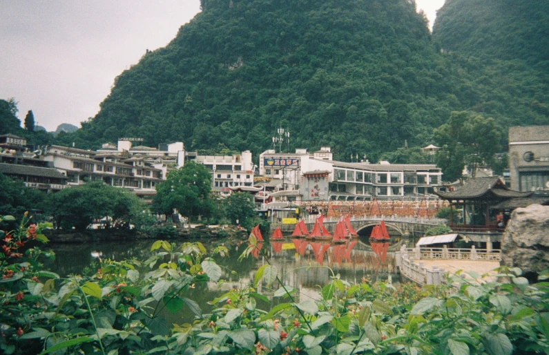 an image of a landscape of buildings and a mountain