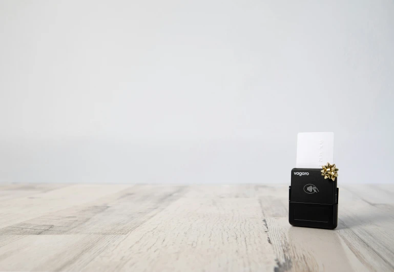 a mobile phone sitting on top of a table