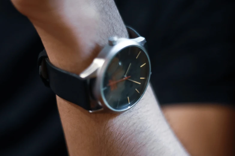 a watch on someone's wrist showing the time