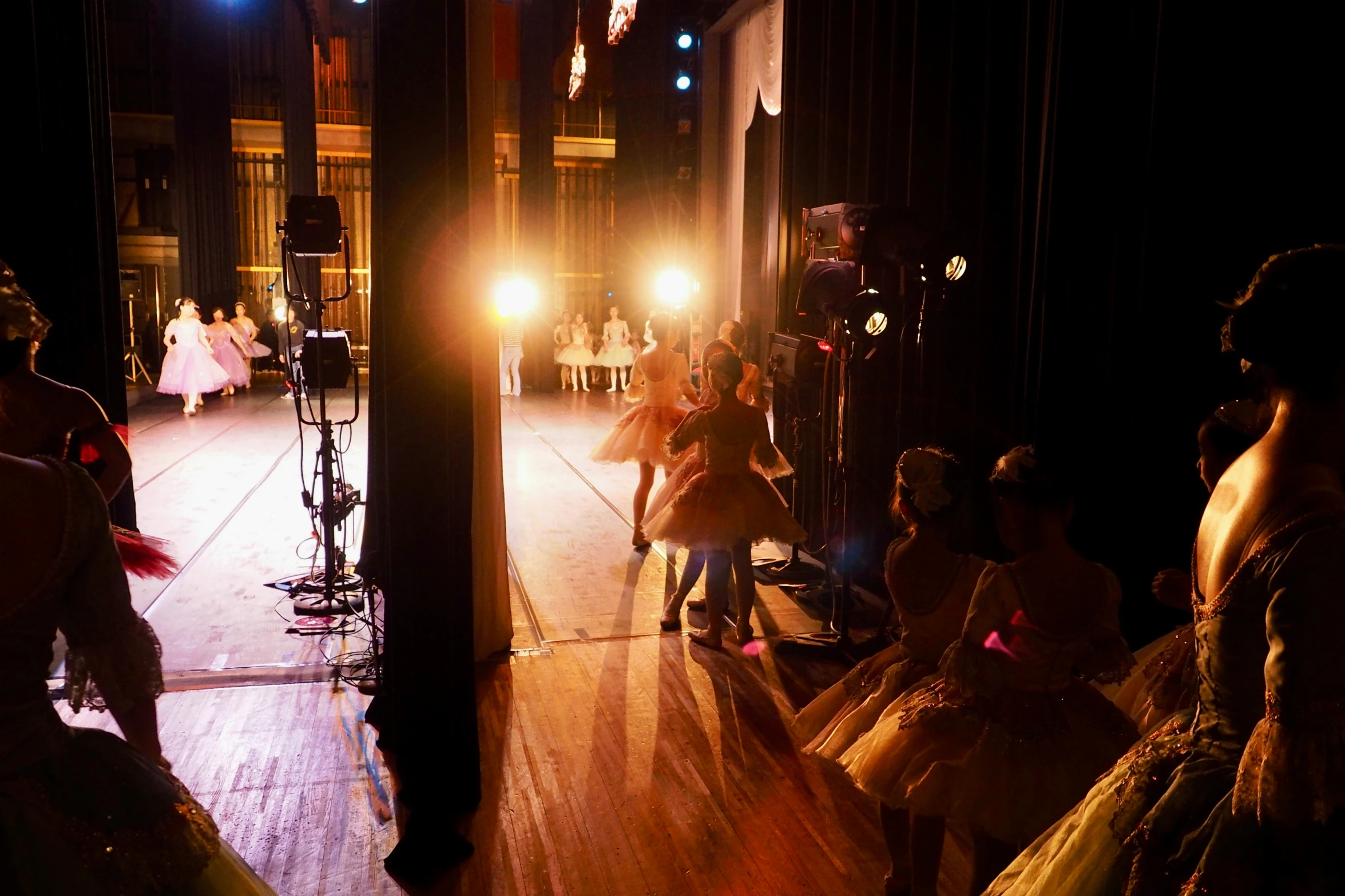 a bride and groom are pographed inside a dark hall by their wedding party