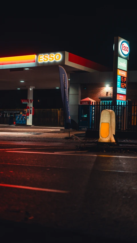 gas station at night with light from the headlights