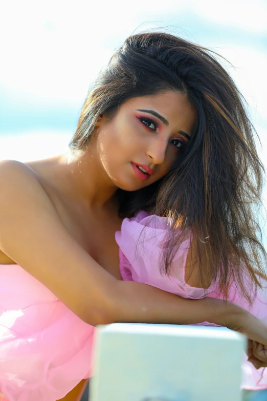 a young lady in a pink top and matching clothes