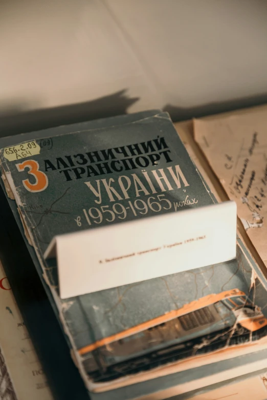 an old russian literature book is on a table