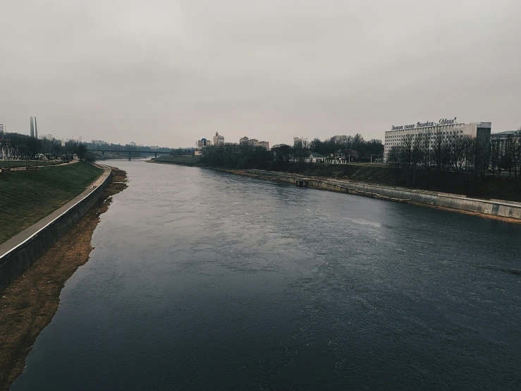 the river running through a city in the day