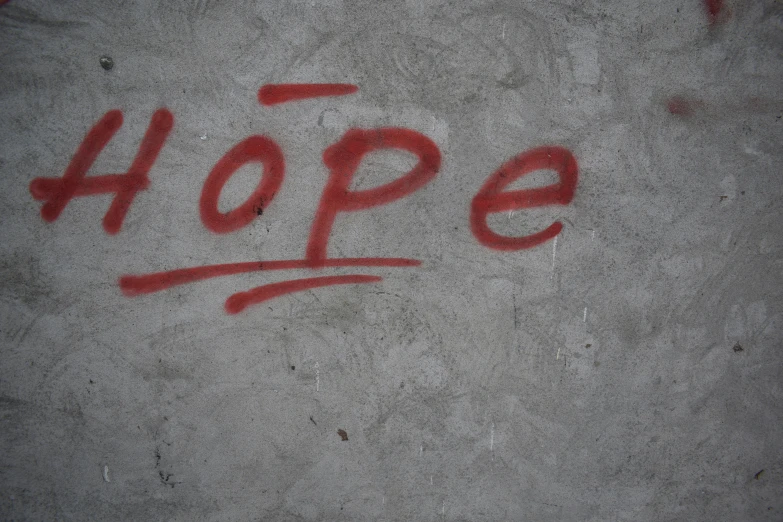 graffiti on the concrete reads hope