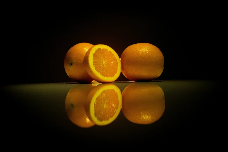 some oranges are arranged to look like they are half peeled