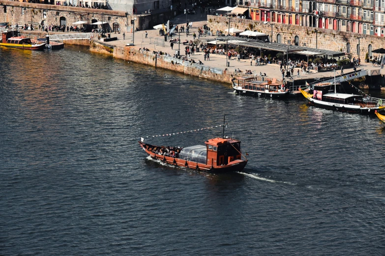 a boat in the water near an old building