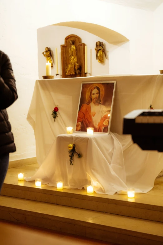 the altar is decorated with candles and images