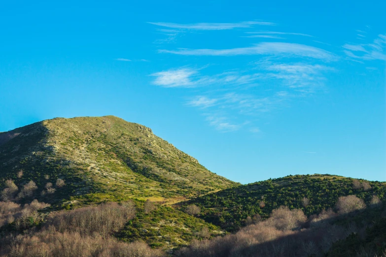 the top of a mountain with trees below