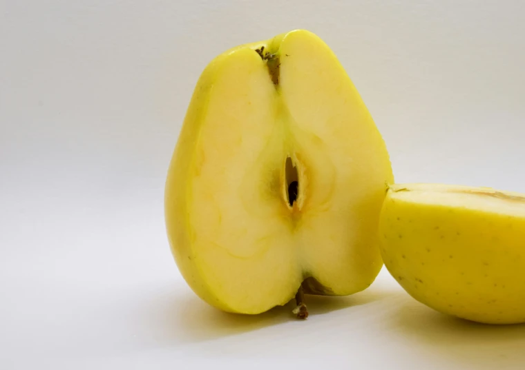 an image of an apple sliced in half