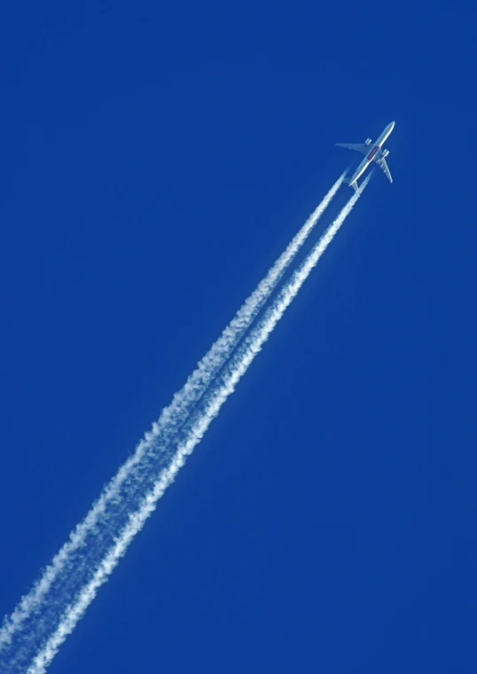 a small plane high up in the sky