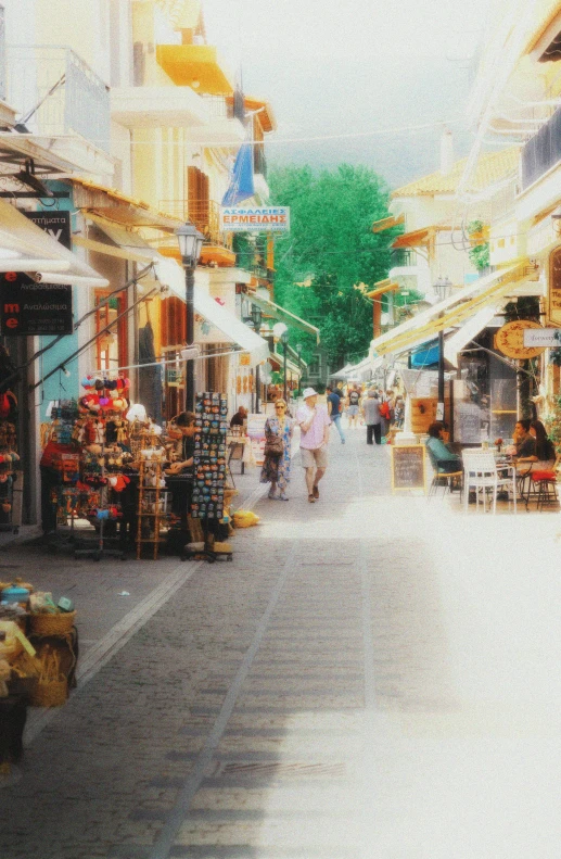 a busy street with vendors and people walking