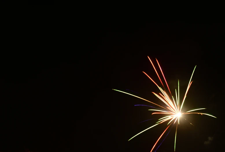 the big fireworks is glowing bright orange and purple