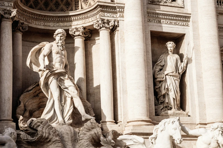 two statues of different sizes and colors are on display