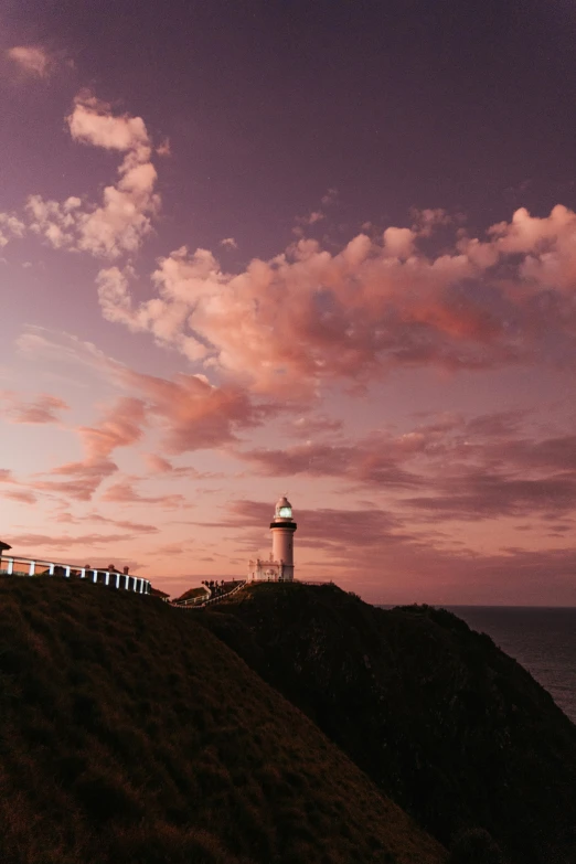 a light house sitting on top of a hill